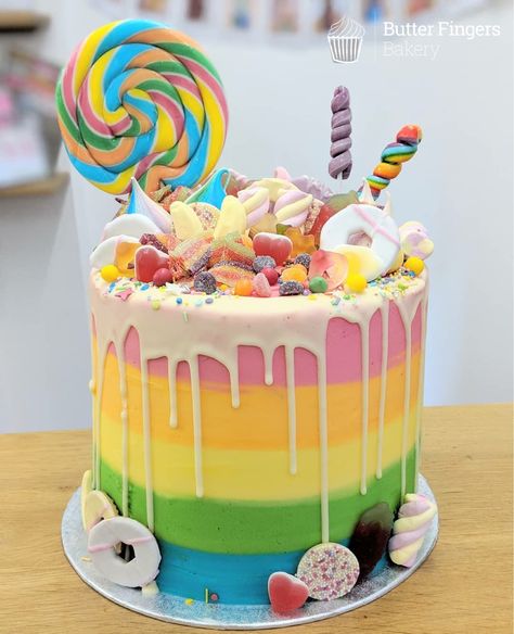 A tall sweetie overload birthday cake #cake #birthday cake #tallcake #rainbowcake #rainbow #colourful #dripcake #buttercreamcake #sweets #candy #sweetieoverload #lollipop #party #kidscake Sweetie Cake, Colorful Birthday Cake, Candyland Cake, Birthday Cake Cake, 7th Birthday Cakes, Lollipop Cake, Butter Fingers, Lollipop Party, Candy Birthday Cakes