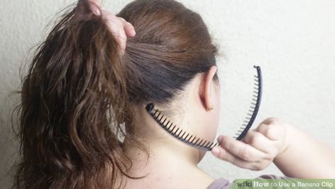 3 Ways to Use a Banana Clip - wikiHow How To Style Banana Clips, How To Put Your Hair Up In A Banana Clip, Banana Clip Faux Hawk, How To Style Hair With Banana Clip, Banana Clip Hairstyles Long Hair, 80s Banana Clip Hairstyles, How To Wear Banana Clip, Banana Comb Hairstyles, Hairstyles With Banana Clips