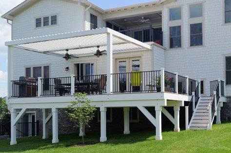 This Equinox Adjustable Louvered Roof offers home owners the best of both worlds: sunlight streaming onto their deck and into their home with open louvers and protection from rain with closed louvers. Solar-powered and virtually maintenance free. Mention this pin with code KC516 when you buy Equinox from Core for your NoVa, DC or MD home or business and get a free fan installation (you provide the fan) just for finding us here. #deck #equinoxroof #nova, #dc #md #adjustablelouveredroof Deck With Louvers, Porch Roofs, Lake House Patio, Louvered Roof, Deck And Patio, House Patio, Louvered Pergola, Patio Pergola, Porch Roof