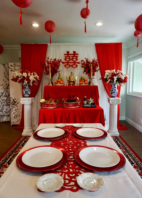 Vietnamese tea ceremony wedding set up. Color scheme is a combination of lucky beight red, white and gold accents. The ceiling has paper lanterns hung from fishing wires giving it a floating effect. Vietnamese Party Decorations, Vietnamese Wedding Ceremony, Mexican Vietnamese Wedding, Vietnamese Wedding Decorations Tea Ceremony, Vietnamese Wedding Reception, Traditional Chinese Tea Ceremony, Vietnamese Tea Ceremony Decor, Viet Tea Ceremony, Vietnamese Engagement Party