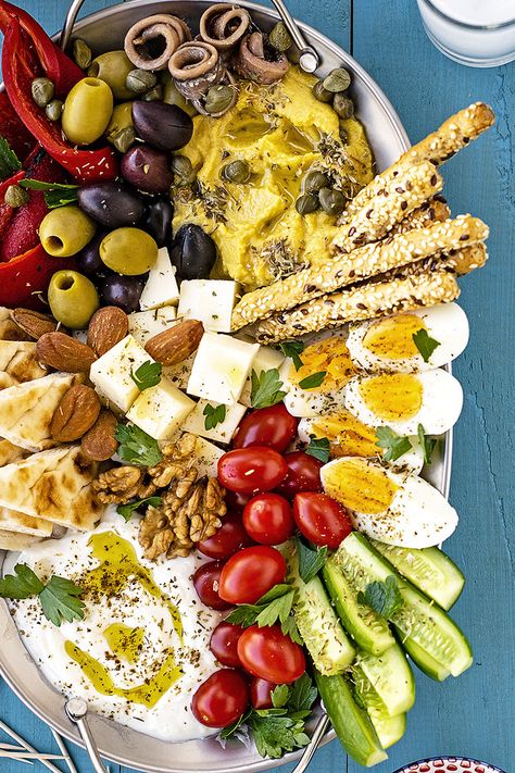 Learn how to make a Greek meze platter and spend a cozy night with your friends eating, drinking, laughing, and having fun! Serve with wine, ouzo, or tsipouro. #Greek #meze #mezze #platter #party #mediterranean Greek Meze Platter, Olives Recipes, Platter Party, Greek Meze, Meze Platter, Mezze Platter, Mediterranean Appetizers, Friends Eating, Apple Crisps