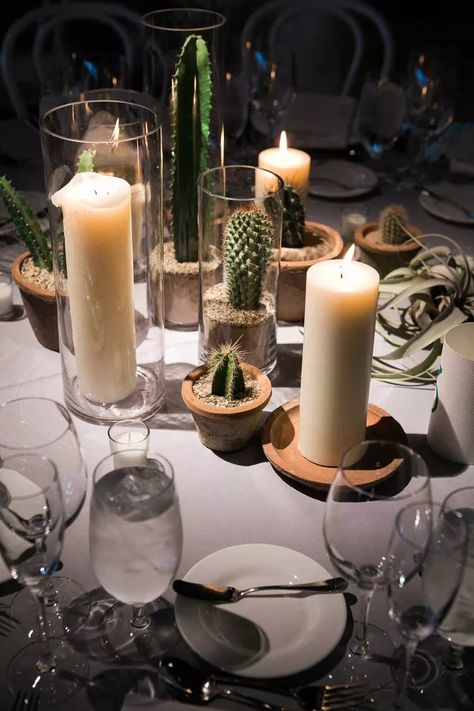 Going modern? Or even boho? Incorporate cacti! Source small cacti in pots and place them on your tables paired with a variety of candles for a whimsical look. Cactus Centerpieces, Wedding Organisation, Wedding Centerpieces Ideas, Cactus Centerpiece, Desert Party, Desert Theme, Hacienda Wedding, Wedding Desert, Cactus Western