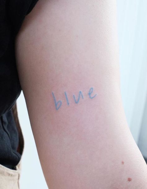 Blue Aesthetic Tattoo, Word Blue Tattoo, Light Blue Tattoo Ink, Colorful Word Tattoos, Tiny Blue Tattoo, Light Blue Ink Tattoo, Blue Word Tattoo, Blue Ink Tattoo Words, Pastel Tattoo Ideas