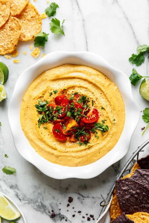 Grab your favorite corn chips, cause creamy, cheesy vegan nacho queso is coming your way! This magical recipe is so good you'll never believe it doesn't contain cheese. Instead, this vegan queso recipe is loaded with healthy whole-food ingredients that pack some nutrition into each bite. Vegan Queso Dip, Vegan Queso, Vegan Nachos, Queso Recipe, Vegan Cheese Sauce, Mexican Spices, Dairy Free Cheese, Sunday Meal Prep, Free Meal Plans