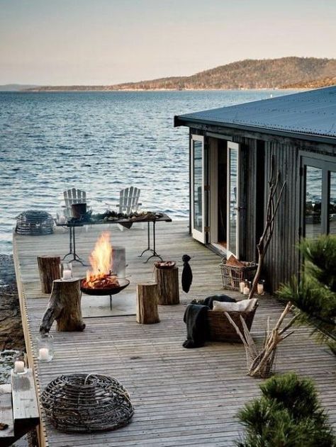 You need a house by the water any time, but most of all, you really really need one in the summer. With a deck or a dock to sit on and enjoy some wine or cocktails with your friends while the sun goes down. It's all a part of the life well-lived. Satellite Island, Design Exterior, Garden Cottage, Outdoor Fire, Beach Cottages, Design Case, Coastal Living, Tasmania, A Fire