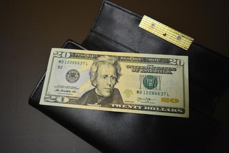 Paper note in the amount of twenty American dollars, $ 20 lies on a black wallet made of genuine leather. Currency of the United S royalty free stock photography American Dollar, Paper Note, 20 Dollars, S Photo, States In America, New Photo Download, Money Transfer, Black Wallet, Photo Download