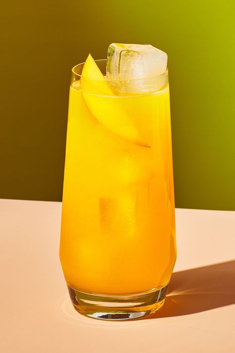 This simple summer refresher features John deBary’s Super Summer Fruit Syrup, a bright and glorious infusion of peak summer fruit like peaches and mangoes, infused with chamomile, ginger, and turmeric. In addition to sparkling water, it also plays exceptionally nicely with tonic water and sparkling wine. Fresh Drink Photography, Fruit Drink Photography, Summer Drink Photography, Mango Drink Photography, Peach Drink Photography, Drink Styling, Fruit Syrup, Water Photoshoot, Advertisement Design