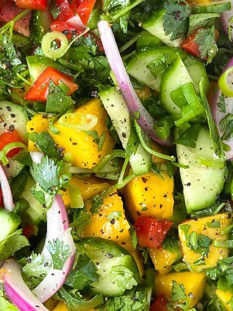 Close up of mango cucumber salad. Essen, Cucumber Mango Salad Recipes, Mango Salad Recipes, Fruit And Veggie Diet, Mango Cucumber Salad, Salad Variations, Raw Salads, Mango Salad Recipe, Potluck Salad