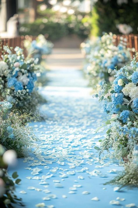 Blue flowers and petals adorn a wedding aisle. Unleash your inner florist with wild and whimsical floral wedding ideas that will make your special day bloom like never before. Whimsical Floral Wedding, Floral Wedding Ideas, Floral Wedding Decor, Sky Blue Weddings, Aisle Flowers, Floral Wedding Cake, Rustic Wooden Table, Floral Wedding Decorations, Wedding Decor Ideas