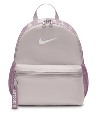 A small but mighty bag, the Nike Brasilia JDI Backpack is just the bag for wherever your day takes you. Perfect for hanging out with friends or adventuring around town, this bag features a spacious double-zippered main compartment for the essentials and a smaller front pocket for the small stuff that you need to grab quickly. Shown: Platinum Violet/Plum Dust/White Style: DR6091-019 Nike Brasilia Backpack, Nike Mini Backpack, Backpack Nike, Nike Bag, Nike Backpack, Small Stuff, Christmas Wishlist, Mini Backpack, White Style