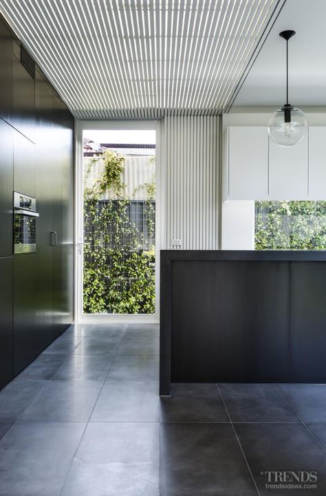 Contemporary kitchen design in garden pavilion-style addition open to outdoors White Cabinets Wood Countertops, Slat Ceiling, Basalt Tile, Wood Slat Ceiling, Ultra Modern Kitchen, Mobile Kitchen Island, Timber Slats, Timber Roof, Timber Ceiling