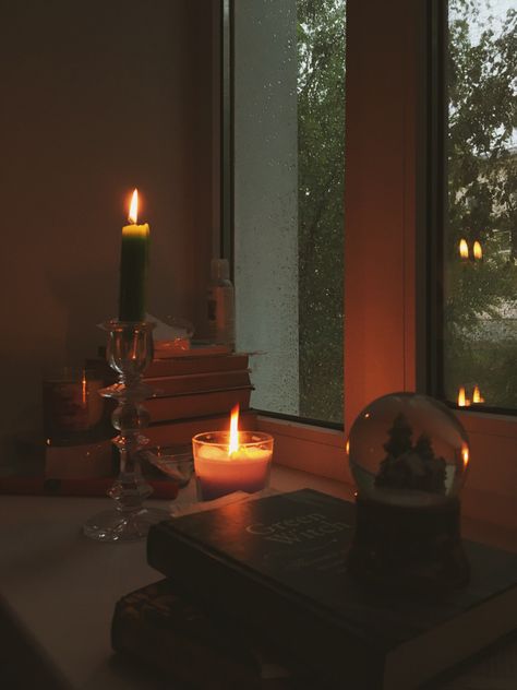 Rain, burning candles, books and magic. Burning Candles Aesthetic, Rain And Candles, Candles And Rain, Rain Candle Aesthetic, Candle And Rain Aesthetic, Witchy Room Aesthetic, Library Candles Aesthetic, Books Candles Aesthetic, Candle Light Room