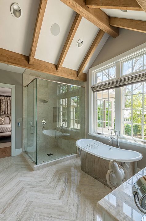 Bathroom with vaulted beamed ceiling and large herringbone floor tiles. The large herringbone floor tiles were supplied by Walker Zanger. bathroom-vaulted-beamed-ceiling #bathroom #vaultedceiling #vaultedbeamedceiling #largeherringbonetile Allan Edwards Builder Inc Vaulted Ceiling Bathroom, Herringbone Floor Tiles, Transitional French Country, French Country Interiors, Ceiling Bathroom, French Country Bathroom, Best Modern House Design, French Country Bedrooms, Country Bathroom