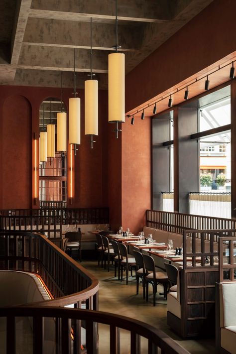 Maison François brasserie takes cues from Ricardo Bofill's architecture Ricardo Bofill, Walnut Timber, Walnut Dining Chairs, Design Café, Restaurant Seating, Saint Luke, Stucco Walls, The Guild, French Restaurants