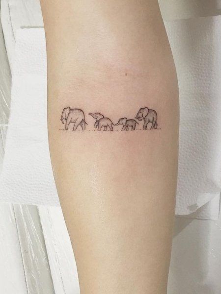 23 Meaningful Family Tattoos That Show Your Love- The Trend Spotter Tattoos For A Family Of Four, Small Tattoos For Family Symbols, Family Of Three Tatoos, Tattoo Family Of 3, Small Mother Tattoos Simple, Family Micro Tattoo, Tattoos For Your Family, Tattoos For Families, Always There Tattoo