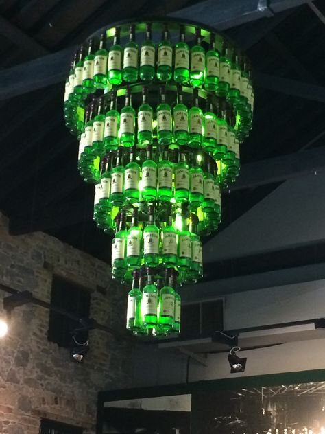 Beer Bottle Chandelier, Whiskey Bottle Crafts, Beer Bottle Diy, Diy Bottle Lamp, How To Make A Chandelier, Bottle Chandelier, Jameson Whiskey, Liquor Bottle Crafts, Crate Furniture Diy