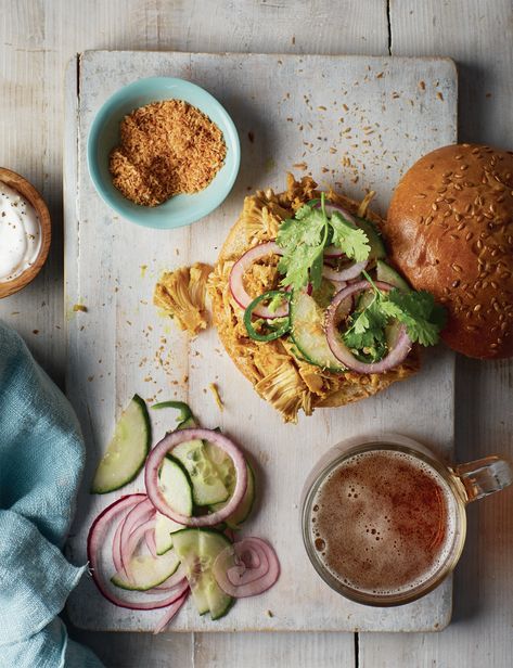 Jackfruit Rendang Burger – A Flavor-Packed Delight! Serves: 4 Ingredients: For the Burger: 2 × 400g tins jackfruit 2 tsp steak seasoning 2 tbsp vegetable oil (divided) 200ml coconut milk 4 tbsp desiccated coconut Salt and black pepper For the Spice Paste: 1 lemongrass stalk 1 onion 3 garlic cloves Thumb-sized piece fresh ginger 1 tsp dried chilli flakes 1 tsp ground turmeric 1 tsp ground cinnamon 1 tsp sugar For the Red Onion Topping: 1 lime 1 red onion ½ cucumber 1 fresh green chilli To ... Desiccated Coconut, Ground Turmeric, Steak Seasoning, Green Chilli, Chilli Flakes, Fresh Green, Ground Cinnamon, Fresh Ginger, 4 Ingredients