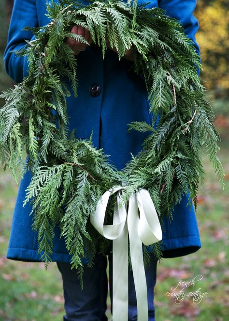 You might have noticed that I pretty much love using fresh greens  for Christmas decorating in my home For everything from dressing the mantels  to making my own simple fresh cedar wreaths. You know those  unstructured and oh so pretty wreaths that look like you just walked out into your yard  filled a basket with… French Country Cottage Christmas, Cedar Branch, Branch Wreath, Cedar Wreath, Fresh Garlands, French Country Christmas, Christmas Tree Lots, Easy Christmas Wreaths, Pretty Wreath