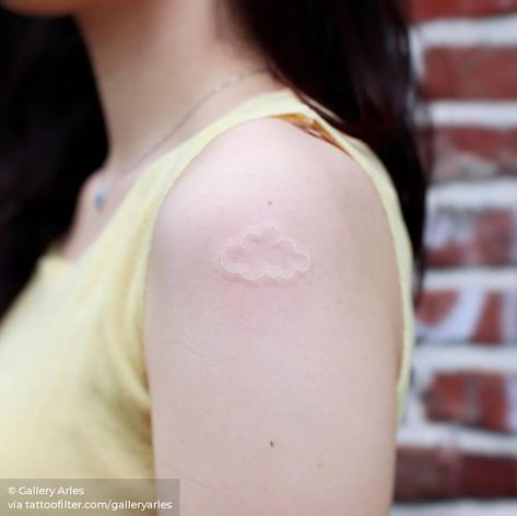 White ink cloud tattoo on the shoulder. Tattoo On The Shoulder, Small Nature Tattoo, Cloud Tattoo Design, Weather Symbols, White Ink Tattoo, Explore Tattoo, Cloud Tattoo, Nature Clouds, Toenail Polish