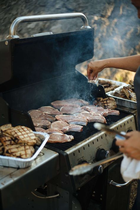 The Taste SF is excited to grill and recommends these grilling cookbooks, grilling tools, and recipes. See how to grill Pork Chops in Montana with Chefs from Ox Restaurant in Portland, Greg Denton and Gabi Denton, at The Resort at Paws Up. #grilling #bbq #food #recipe #grill #travel #recipe Zac Core, Bbq Photoshoot, Grilling Aesthetic, Bbq Photography, Grill Pork Chops, Man Grilling, Restaurant Grill, Grilling Essentials, Easy Summer Cocktails