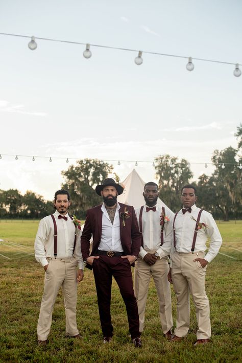 Groom and groomsmen at a glamping-themed, music festival-inspired wedding styled shoot at a rustic ranch venue. #groom #groomsmen #boho #bohostyle #bohowedding #rusticwedding #styledshoot Groom Vest No Jacket, Rustic Wedding Suits Groom Style, Desert Groom Attire, Beige Groom Black Groomsmen, Boho Groomsmen Attire Bohemian, Mixed Groomsmen Suits, Groom Suit Boho, Boho Mens Wedding Attire, Bohemian Groom Attire