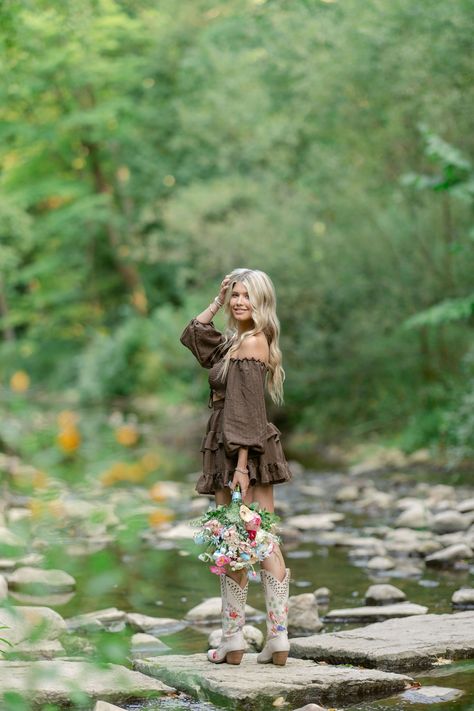 Wisconsin-based photographer photographs a western-themed seniors session with the senior taking photos on a creek in Appleton, while she's dressed in a cute flowy brown dress, with her cowgirl boots, and many other location ideas and inspiration for senior portraits.  #Westernseniorportraits #Appletonphotographer #Wisconsinseniors Western Style Senior Photos, Photo Shoot With Horses Cowgirl, Senior Picture With Mirror, Senior Picture Western Outfits, Poses For Sweet 16 Picture Ideas, Cowgirl Boot Senior Pictures, Fall Senior Picture Ideas Outfits Country, Senior Photos In Creek, Cute Country Senior Picture Ideas