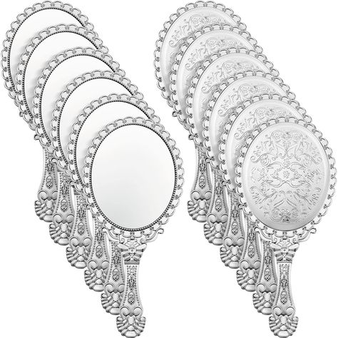 PRICES MAY VARY. What You Will Get: you will receive 12 pieces vintage handheld mirrors in silver color, can properly meet your daily requirement to match with your different mood, you can also share extra mirror with your friends and families Embossed Flower Design: these hand held decorative mirrors are designed with comfortable handles for long time holding, these classic decorative mirrors are embossed with retro flowers to show elegance, oval shape and retro elements will gain most girls' f Princess Mirror Party Favor, Sweet 16 Cinderella Theme, Vintage Handheld Mirror, Cinderella Party Favors, Mirror Favors, Princess Mirror, Hand Held Mirror, Compact Mirror Vintage, Vanity Makeup Mirror