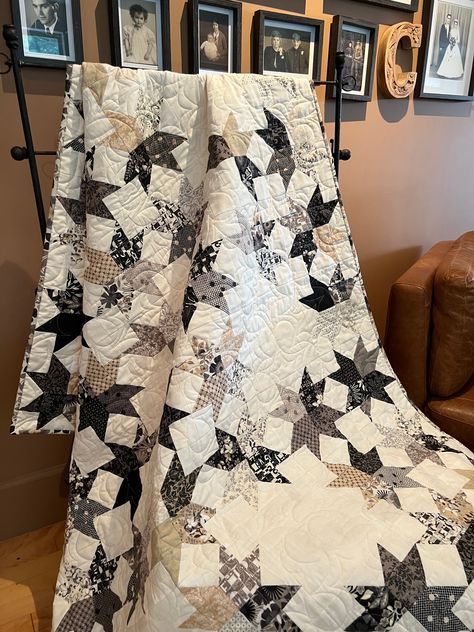 This 56" x 64" lap quilt is perfect for the stay-at-home movie date night! This project uses a layer cake from the beautiful fabric collection "Date Night" by Basic Grey for Moda. A demo video on how to make the star block for this project is available on my website under demo videos. Date Night will be shipping to your favorite quilt shop in January 2023, but the pattern is available for purchase now! This pattern is FabSwitch compatible. FabSwitch is my free app which allows you to switch out Neutral Colored Quilt, Monochromatic Quilt, Stars Quilt Pattern, Lap Quilt Patterns, Neutral Quilt, Farmhouse Quilts, Layer Cake Quilts, Black And White Quilts, Stars Quilt