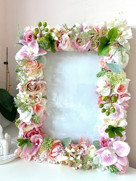 Custom Pink Floral Photo/ Picture Frame in variety of colours and sizes available. What an amazing way to display your favourite pictures or quotes! Beautiful frame with lots of detail- silk flowers and foliage.  Perfect Home Decor or great for any occasions such as weddings- great as a centrepiece, seating plan, funerals, christening, birthdays.  Perfect Nursery Decor, Baby shower Centrepiece or perfect as a gift such as for a couple or weddings.  We can also match floral frames with letters for that complete look. You can leave me a note with your desired colour choice, otherwise we use a mixture of flowers and colours.  Picture Frame can be either hanged on the wall or freestanding. Please note, due to the handmade nature of this item and flower availability, it may not look identical t Floral Photo Frame, Flower Photo Frame, Nursery Picture Frames, Pink Picture Frames, 3d Picture Frame, Perfect Nursery, Flower Picture Frames, Framed Wedding Photos, Custom Photo Frames