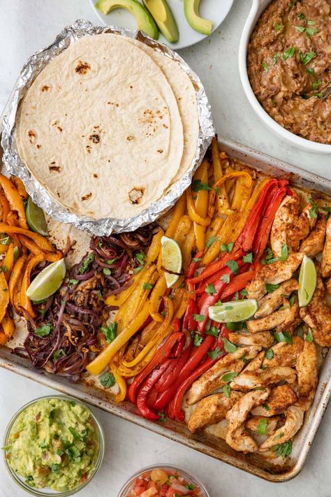 These chicken fajitas are baked in the oven on a sheet pan for a fuss free family meal that is full of flavor. Made with an easy homemade fajita seasoning. Damn Delicious Sheet Pan Chicken Fajitas, Easy Oven Baked Sheet Pan Chicken Fajitas, Lunch Oven Recipes, Healthy Sheet Pan Fajitas Chicken, All Food Group Meals, Mexican Tray Bake, Fajita For A Crowd, Dinner For Entertaining Friends, Chicken Fajitas Dinner Sides