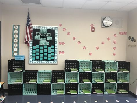 DIY student cubbies; turquoise and black classroom; vowel sound wall Classroom Wall Organization, Student Cubbies In Classroom, Classroom Storage For Students, Classroom Cubbies Ideas, Daycare Cubbies Ideas, Yurt Classroom, Cubbies For Classroom, Classroom Cubby Ideas, Diy Classroom Cubbies