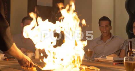 People Watching Hibachi Chef Lighting Fire While Cooking, Restaurant Restaurant Ad, Cooking Restaurant, People Watching, Stock Video, Chef, Restaurant, Lighting