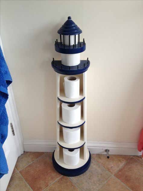 Unique Ways to Use Lighthouses for Decor - Beach Bliss Living Lighthouse Bathroom Decor, Lighthouse Bathroom, Nautical Bathroom Design Ideas, Tre Kunst, Lighthouse Decor, Nautical Bathroom Decor, Toilet Paper Roll Holder, Beach Theme Bathroom, Bathroom Themes