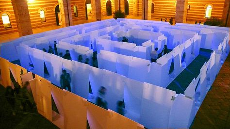 Coloured Labyrinth indoors, constructed of white panels, lit with blue and orange lights. Very dramatic. Fall Festival Decorations, Mirror Maze, Maze Design, Dog Search, Carnival Themes, Exhibition Booth, Boutique Interior, Scenic Design, Stage Design