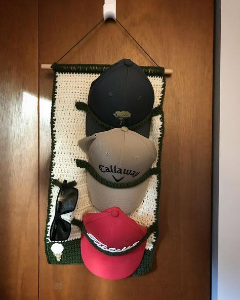 Wall hanging hat and sunglasses holder for my dad’s Father’s Day gift. He is an avid golfer and man with many hats. Peep the golf ball and tee in the left corner (yes it does also look like an ice cream cone haha) 🧢⛳️ • • • • #golf #fathersday #gift #dad #father #crochet #hat #hats #hatholder #golfhats #sunglasses #lifestyle #homedecor #organization #homeorganization Crochet Golf Accessories, Grandpa Crochet Gifts, Golf Crochet Patterns, Crochet Gift For Husband, Crochet Golf Ball, Crochet Hat Holder Pattern, Crochet Gift Ideas For Guys, Crochet Christmas Gifts For Men, Mens Crochet Gifts