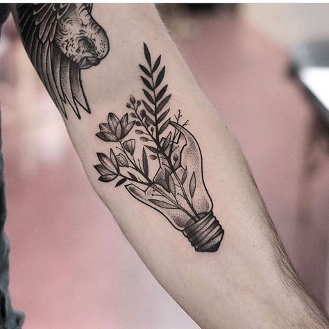 Plants in a lightbulb tattoo inked on the left forearm by Jonas Ribeiro Tattoos Of Growth, Tattoos On Growth, New Growth Tattoo, Tattoo Ideas About Growth, Tattoo Ideas For Growth, Growth Tatoos, Tattoos Growth, Tattoo About Growth, Tattoos That Mean Growth