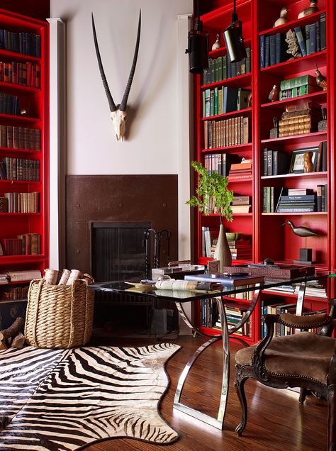 Home office filled with drama and lots of red:  the zebra rug and amazing skull with horns stand out amidst the red bookshelves. Red Bookshelf, Red Interior Design, Zebra Rug, Red Office, Paint Trends, Red Decor, Red Rooms, Luxe Interiors, Red Walls