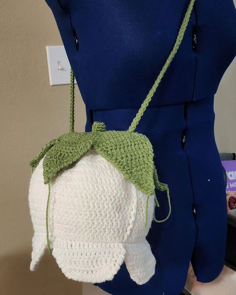 Sneak peek 👀 my new pattern Lily of The Valley crossbody bag. This is just the prototype. Making the necessary adjustments and then I'll be calling for a tester call ☺️☺️ #crochetersoftheworld #crochetersofinstagram #crochetdesign #crochet #crocheted #crochetbag #crochetdesign #crochetdesigner #crochetstitches #bag #flower Lily Of The Valley Crochet, Crochet Lily Of The Valley, Crochet Bucket Bag, Crochet Lily, Lily Bag, Crochet Apple, Crochet Crossbody Bag, Crochet Bouquet, Bag Flower