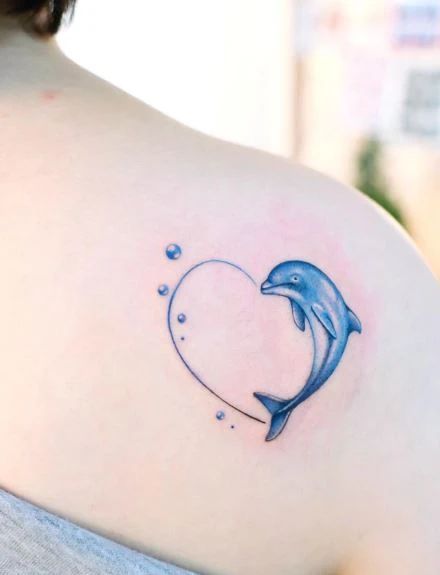 60+ Dolphin Tattoo Ideas That You Can Dive Right Into Fine Line Dolphin Tattoo, Cute Mermaid Tattoo, Simple Dolphin Tattoo, Minimalist Dolphin Tattoo, Dolphin Tattoo For Women, Small Whale Tattoo, Dolphin Tattoo Ideas, Dolphin Tattoo Design, Henna Fun