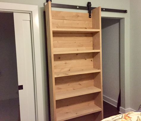 Our rad new sliding closet bookshelf barndoor -- Thanks Tommie Silva! Secret Bookcase Sliding Door, Sliding Door Shelves, Sliding Storage Door, Sliding Door With Storage, Diy Door Bookcase, Sliding Storage Doors, Sliding Book Shelves, Sliding Door With Shelves, Bathroom Storage Sliding Door