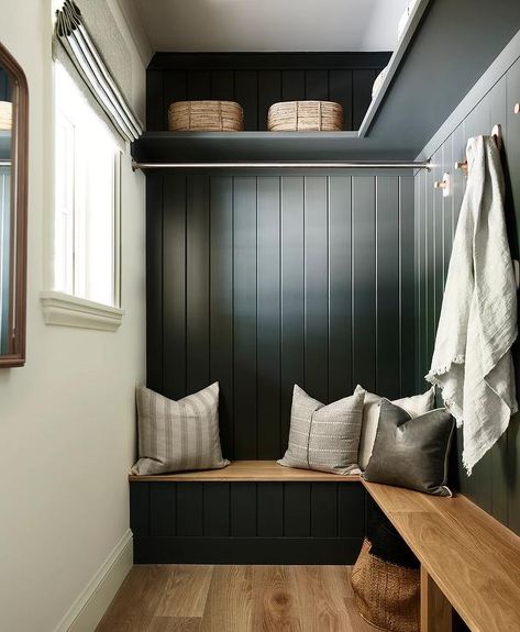 An l-shaped wood top mudroom bench is fixed against a black shiplap backsplash under a tension rod and brass hooks fixed under an l-shaped black shelf. Cottage Laundry Room, Waterfront Cabins, Laundry Room Ideas Small Space, Mudroom Bench Cushion, Mudroom Bench Seat, Lake Winnipesaukee, Lake Cabin, Laundry Room Diy, Small Laundry Rooms