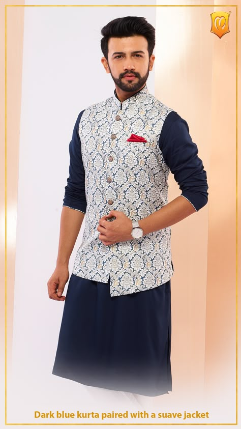 Go bold and dashing in this midnight blue kurta paired with an asymmetric jacket uplifted with traditional motifs. Style Tip: Put on a matching pair of jutis to give your attire a monochrome look. Pre-book your appointment or shop online. Fashion couture, Indian couture, Indian wear, Indian wedding, ethnic wear for men, Kurta Jacket, Kurta, traditional wear, kurta jacket for men Coti Style Kurta For Men, Manyavar Kurta Indian Weddings, Mens Traditional Wear Indian Wedding, Manyavar Kurta, Kurta Pajama With Nehru Jacket, Traditional Indian Mens Clothing, Kurta Pyjama With Jacket, India Fashion Men, Indian Wedding Suits Men