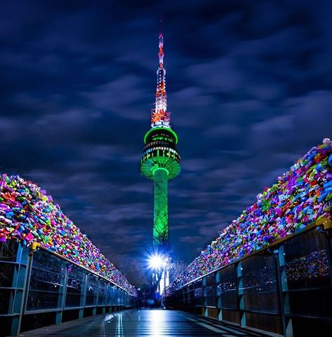 This photo was taken on the path way up to N Seoul Tower (officially the YTN Seoul Tower & commonly known as the Namsan Tower). It's a communications & observation tower located on Namsan Mountain in central Seoul, South Korea. Standing at c. 236m, it's the highest point in Seoul. The colorful sides represent “love locks” bolted to the side of the bridge way. Namsan Seoul Tower, N Seoul Tower, Seoul Tower, Namsan Tower, South Korea Seoul, South Korea Travel, Korea Travel, Dream City, Seoul Korea