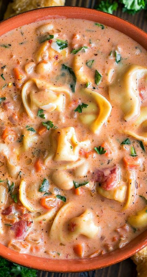 This creamy Tuscan Tortellini Soup is crazy delicious and can made quickly in just one pot! Aren't one-pot recipes the best?! Each luscious bowl is loaded with cheesy tortellini, fresh veggies, and tender white beans for a filling and flavorful soup!  This vegetarian recipe is easy to make and totally crave-worthy! Sopa Toscana, Creamy Tuscan Tortellini, Tortellini Soup With Spinach, Tuscan Tortellini Soup, Tuscan Tortellini, Soup With Spinach, Pesto Tortellini, Pasta Salad With Tortellini, Veggie Meals