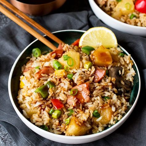 Hawaiian Fried Rice with Easy Sweet and Sour Sauce - Fried rice with pineapple may sound strange, but after you try this recipe, you'll see that it just works! It's made with big chunks of ham and pineapple, veggies and an addicting sweet and sour sauce. Easy Sweet And Sour Sauce, Hawaiian Fried Rice, Luau Party Food, Luau Food, Night Dinner Recipes, Chicken Broccoli Rice, Easy Bacon, Sweet And Sour Sauce, Hawaiian Food