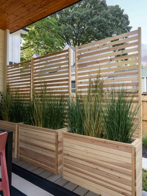 Sleek wood planters filled with ornamental grasses are designed to incorporate a wood screen, adding elegant privacy to the outdoor deck space. Tall Planters For Privacy, Living Wall Outdoor, Privacy Screen Outdoor Deck, Privacy Planters, Deck Privacy Ideas, Privacy Screen Deck, Backyard Planters, Privacy Planter, Outdoor Privacy Screen