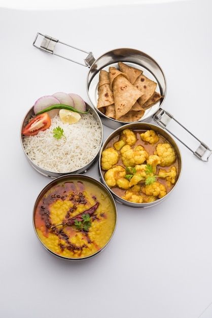 Indian vegetarian lunch box or tiffin ma... | Premium Photo #Freepik #photo #tiffin #indian-food #indian-cuisine #chapati Indian Lunch Box, Masala Rice, Vegetarian Lunchbox, Tiffin Service, Indian Fast Food, Dal Fry, Tiffin Recipe, Meal Box, Tiffin Box