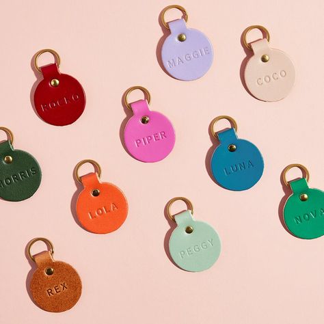 A colourful personalised leather name tag for your pet, the perfect treat for your dog this Christmas. Handmade from sustainably sourced, premium quality British leather and made in the UK, at our studio in the New Forest to be exact. Choose from a range of bright colours, soft pastels or classic neutrals. Each tag is supplied with a solid brass split ring (fancy) and can be stamped with your pet's name in traditionally debossed letters. For an extra £5 you can also personalise the back of the l Cute Dog Collars For Females, Leather Dog Tags For Dogs, Personalised Pet Accessories, Dog Name Tags Unique, Dog Brands, Cool Dog Collars, Dog Tags For Dogs, Cute Dog Tags, Pet Name Tag