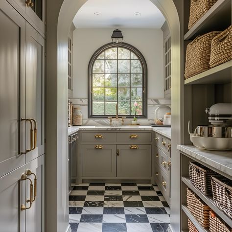 A dream pantry! I love the checkerboard marble flooring in here, and the greige cabinets are a beautiful offset to the brass hardware. An arched window moment is always a beautiful addition, and I love the repetition of the arch from the walkway to the window. ✨ AI Design: @oakhavendesignco . . . . . . . . . . #virtualdesign #virtualdesignservices #edesign #pantry #virtualhomedesign #moodboards #luxeathome #visionboards #prettylittleinteriors #interiorstyle #marble #smmakelifebeautiful #hou... Archway Pantry, Arch Window In Kitchen, Arched Pantry Door, Arched Pantry, Greige Cabinets, Dream Pantry, Arch Doorway, To The Window, Marble Flooring