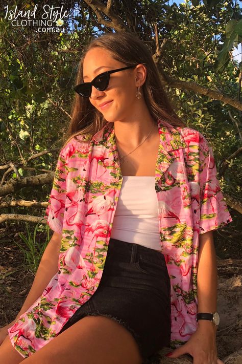 WOMENS CUT RAYON HAWAIIAN SHIRT - Can be easily paired with your favourite wardrobe staples. Perfect for a music festival, beach party, Aloha Friday or casual wear. Features and open neck collar, coconut buttons, short sleeves with a turned-up cuff with button detail. Matching items for the whole family available! #hawaiianshirt #partyshirt #alohashirt #festivalshirt #uniforms #alohafriday #pinkflamingo #flamingoclothing #ladieshawaiianshirt #party #hawaiianthemed #flamingoshirt #womens #shirt Tropical Shirts Women, Hawaiian Festival Outfit, Aloha Shirt Outfit Women, Modern Hawaiian Outfit, Hawaiian Shirts For Women, Aloha Outfit Ideas For Women, Hawian Shirt Outfits, Tropical Shirt Outfit Women, Hawaiian Outfit Women Party Hawaii